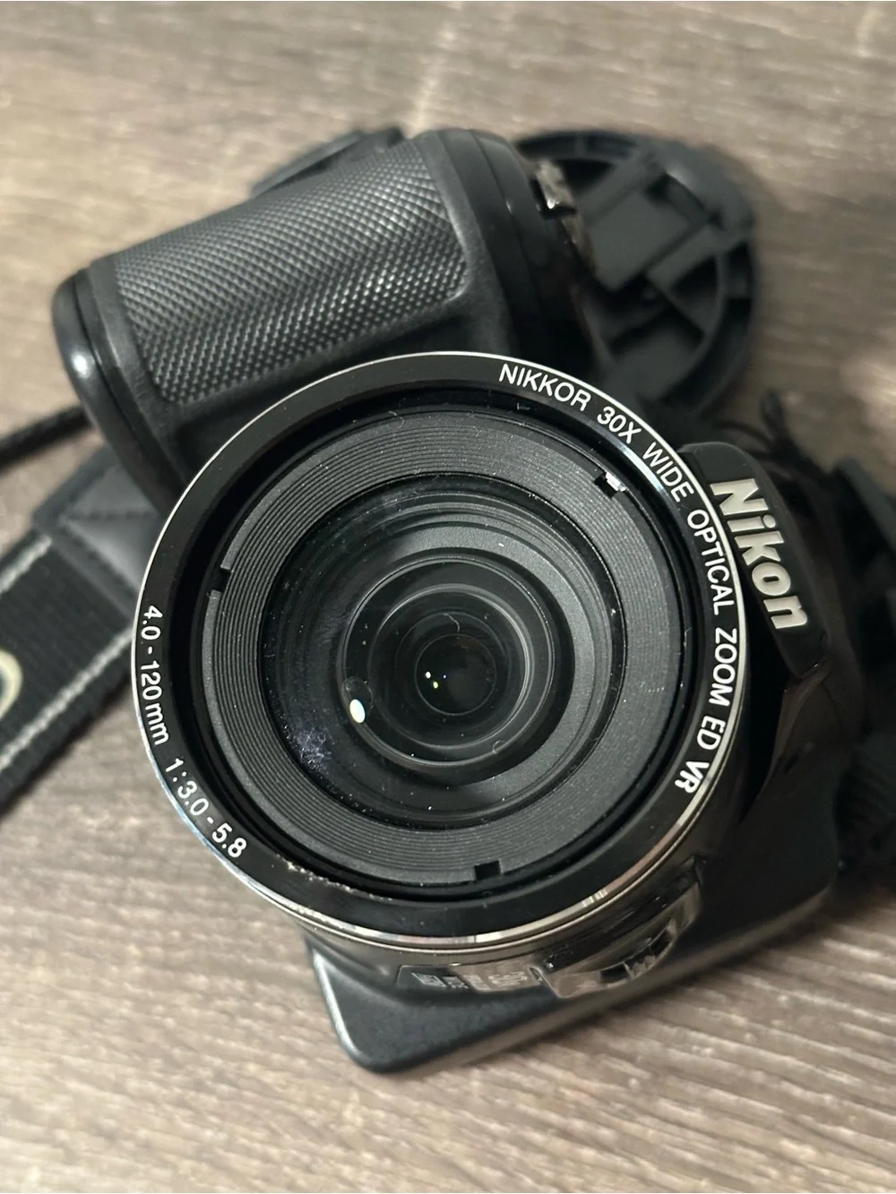 Nikon Black Compact Bridge Camera with Detachable Lens Cap